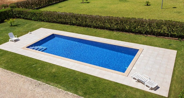 A rectangular swimming pool has a length of 48 feet